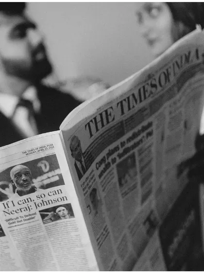 A detail shot from the newspaper series, focusing on the prop. This image helps build the narrative and adds a creative layer to their pre-wedding story.