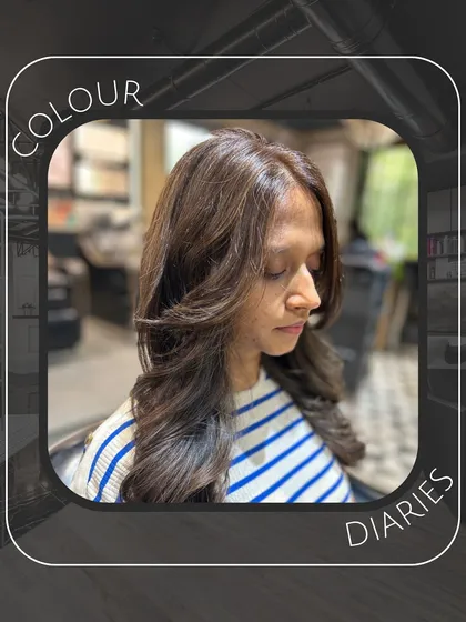 A portrait from our "Colour Diaries" series, featuring a client with a fresh global brown color and a layered blowout for added volume.
