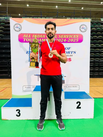 Our coach Akash Gupta on the podium after securing the runner-up position in the Men’s Singles at the All India Civil Services Table Tennis Tournament 2024-25.