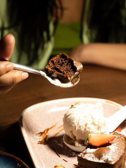 The perfect bite of the chocolate fondant on a spoon. This shot is all about showing the viewer what they're about to experience.