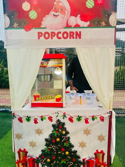 Our festive popcorn stall, fully decorated for a Christmas event. We love customizing our setups to match your party's theme perfectly.