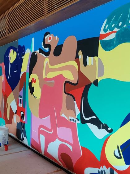 A side view of the mural during its creation.