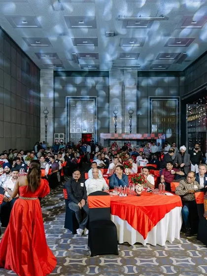 Walking through the audience during a gala dinner, making a large ballroom feel intimate and connected.