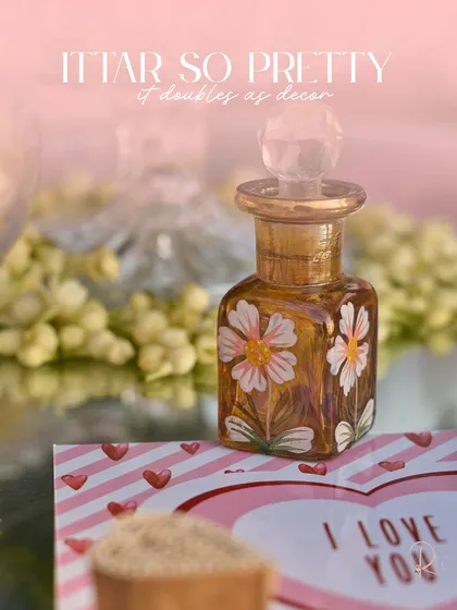 A hand-painted 'ittar' bottle, used as both a favor and a piece of decor. These small, thoughtful details are what make a wedding feel truly unique.