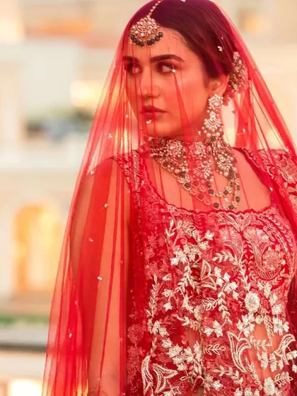 There is nothing more classic than a bride in red. For this look, I focused on creating a radiant glow with a soft smoked liner and a bold red lip, a timeless combination that never fails.