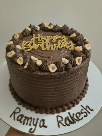 A delicious chocolate hazelnut birthday cake, combining rich chocolate with the crunch of roasted hazelnuts.