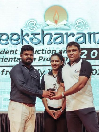 Receiving a token of appreciation at a student induction program at Yenopoya University. It is an honor to partner with an institution that prioritizes the well-being of its students through fitness education.