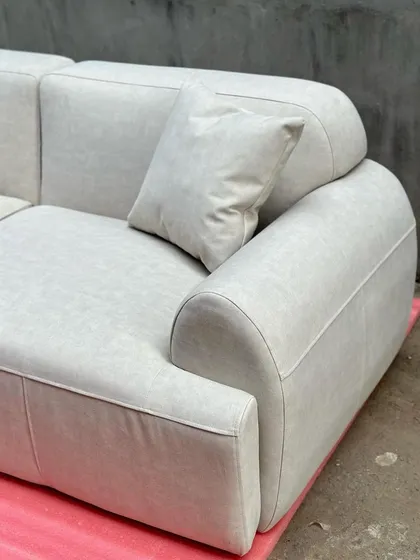 A detail shot of the corner of the modern sofa, showing the quality of the upholstery work.