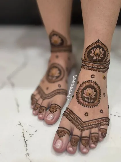 I love bringing your Pinterest dreams to life. This trendy feet henna features a bold lotus mandala, perfect for showing off with open-toed shoes at any celebration.