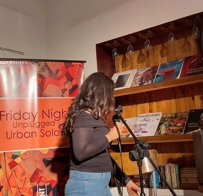 A young singer making her debut on our stage. I am always overjoyed to provide a platform for new talent to step into the spotlight and share their passion.