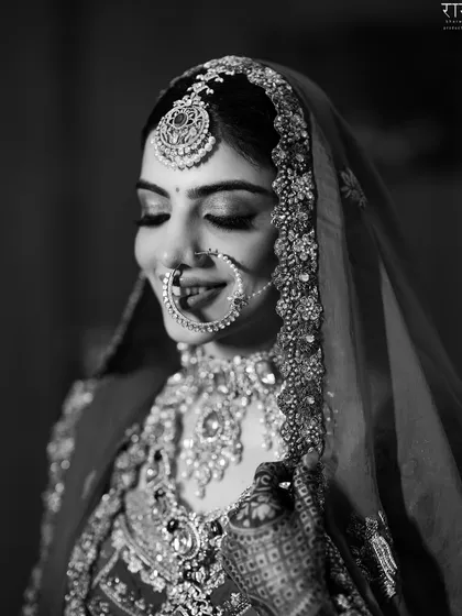 A beautiful black and white portrait of a bride, her eyes closed in a moment of quiet joy. We focus on capturing the emotions that make a wedding day so special.