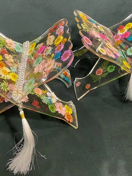 I also create more delicate and unique items, like these custom Quran holders. For this piece, I preserved a vibrant array of real flowers in clear, high-gloss resin, creating a functional piece of art that feels like a garden in bloom.