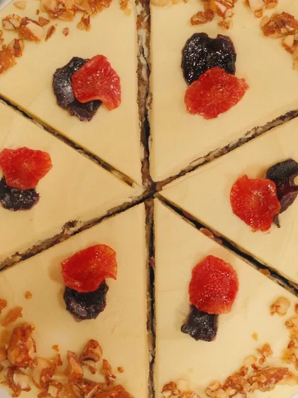 An overhead shot of our Dilli Carrot Cake, sliced and ready to be served. The dried fruits on top add a lovely touch of colour and flavour.