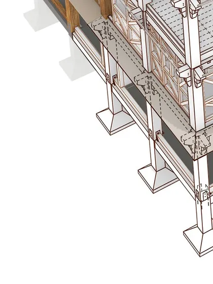 A detailed view of the building's base, illustrating the foundation connections. This is where the timber structure meets the ground, a critical point for transferring loads safely.