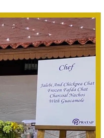 A menu board at one of our live chef stations, highlighting creative chaat options like Jalebi and Chickpea Chaat and Frozen Fafda Chaat, showcasing our innovative approach to traditional snacks.