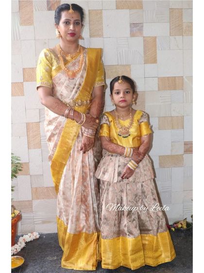 A mother and daughter in matching outfits for a housewarming. I styled the mother with age-appropriate, elegant makeup to coordinate with her daughter.