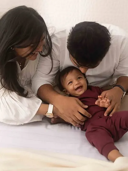 Pure, infectious laughter! Tickles and cuddles on our studio lifestyle bed setup always result in the most genuine and heartwarming family photos.