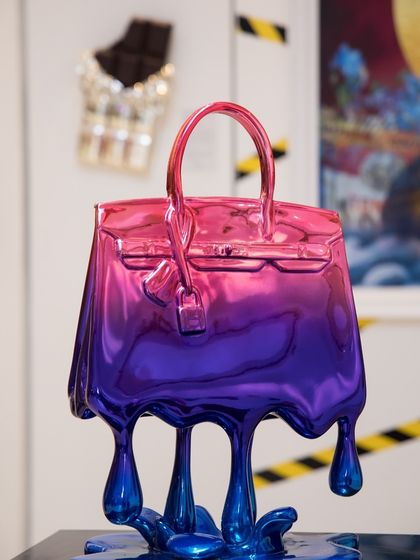 The "Birkin Drip" sculpture in a stunning pink and blue gradient. This chrome-plated fibre piece is a continuation of my Drip Series, paying homage to a timeless symbol of pop culture.