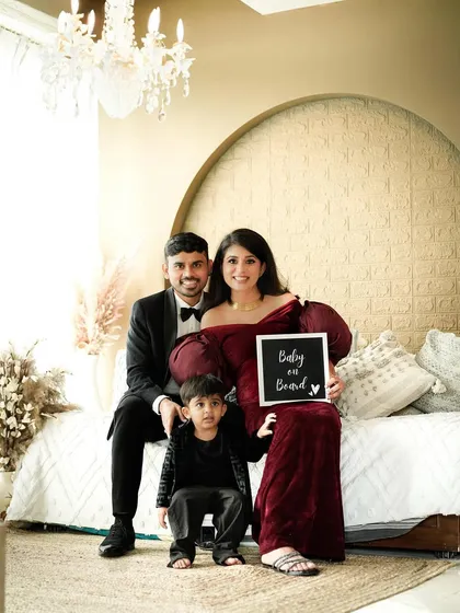 The whole family gathered on our studio bed setup, sharing a happy moment as they announce their wonderful news. These are the memories that become cherished stories.
