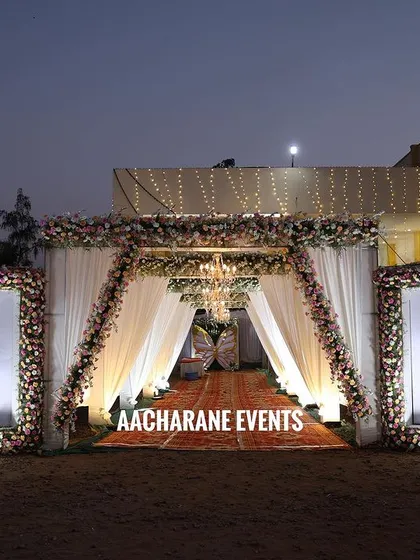 The first impression is everything. I designed this elegant entrance for a night event, using soft drapes, warm lighting, and floral frames with the couple's names to welcome guests and set the tone for a beautiful evening.