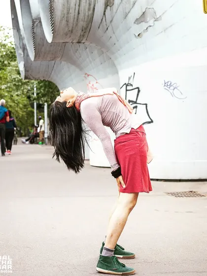 A standing backbend on a city street. My practice is not confined to the mat; it's about finding moments to open my heart and connect with my breath wherever I am.