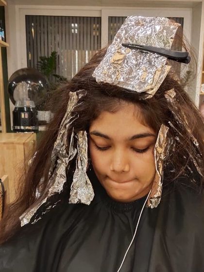 The beginning of a major colour change. This client is ready for a bold new look, starting with the application of foils.