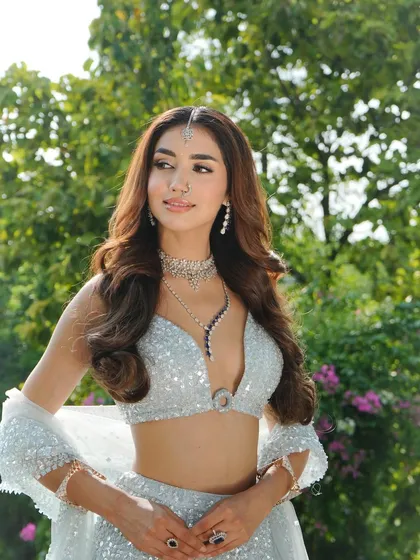 A portrait showcasing the stunning diamond necklace. I chose this piece to elevate the shimmering ice-blue lehenga, making it perfect for an evening reception.