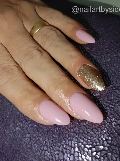 A lovely soft pink manicure with a single gold glitter accent nail for a touch of sparkle.
