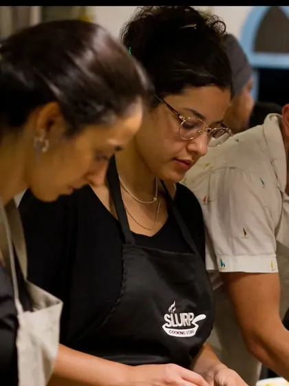Students from The Hebrew University of Jerusalem, fully engaged in learning the nuances of regional Indian cooking.