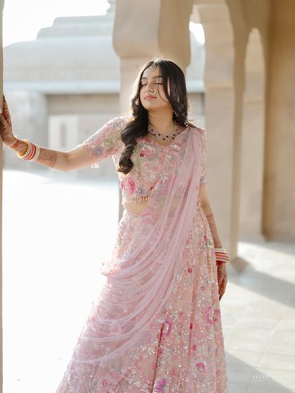 A soft and dreamy portrait. The bride's gentle expression and the beautiful light create a romantic and ethereal mood.