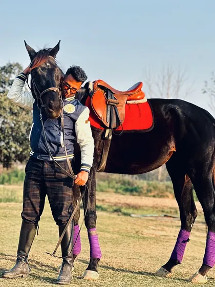 A rider embraces his horse in a field, a simple and powerful expression of the bond they share. These are the moments that truly matter.