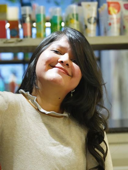This smile is my biggest reward. A happy client enjoying her fresh, bouncy curls after a styling session is what makes my work so fulfilling.
