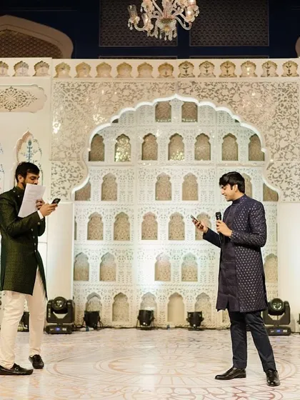 The hosts of the evening rehearsing their lines on stage. The design was intentionally kept classic and elegant to ensure the focus remained on the performances and the family's joy.
