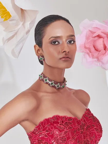 For this campaign, I styled a striking red embroidered corset top with a modern emerald choker. The look is a celebration of bold femininity and intricate craftsmanship.