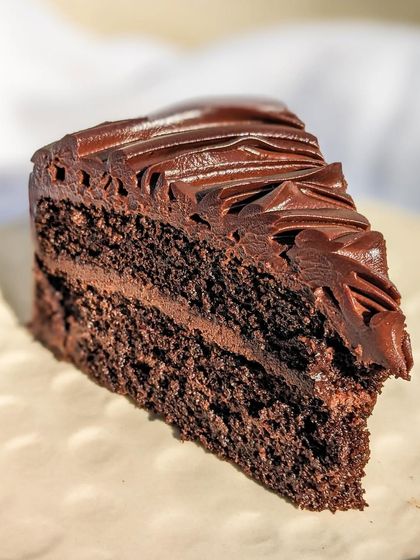 One perfect slice of our Belgian Dark Chocolate cake. It’s the ideal dessert for those who don’t like overly sweet cakes but crave a real chocolate experience.