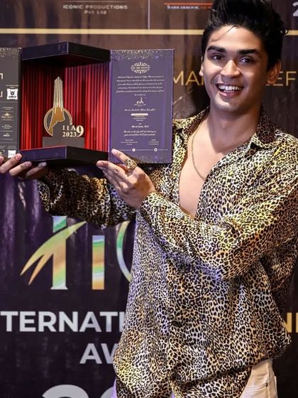 An invited celebrity guest is seen here holding the custom boxed invitation I designed for the International Iconic Awards. The box itself was designed to be a keepsake, featuring a miniature award trophy inside.