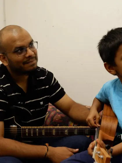 The journey starts here. A snapshot from a one-on-one guitar lesson, where our experienced teachers provide personalized guidance to students of all ages. We focus on nurturing each student's individual style in a warm, supportive environment.