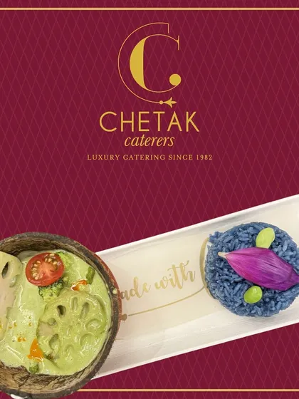 A vibrant and colourful Thai Green Curry with vegetables and lotus stem, served in a coconut shell with a side of butterfly pea flower rice. This dish is a journey to Southeast Asia.