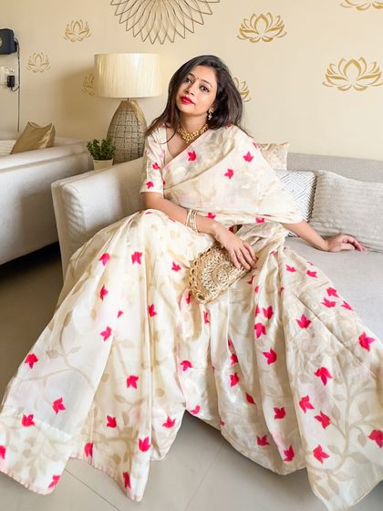 A full, flowing shot of the Bijoya saree. This shows the beautiful drape and movement of the Dhakai Jamdani, a must-have for any saree enthusiast.