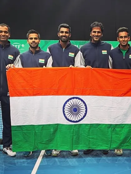 A team photo with the Indian flag is a tradition. It represents our unity and shared goal of making the nation proud. I'm grateful to play my part in this journey.
