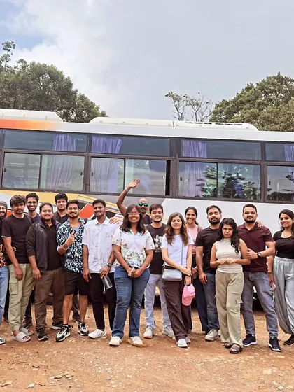 Our group posing for a photo in front of the bus, ready to head home after a fantastic weekend trip exploring nature.