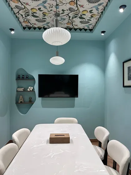 A closer look at the details in my conference room. The organically shaped, recessed wall shelf adds a unique sculptural element, providing a small display area without cluttering the room.