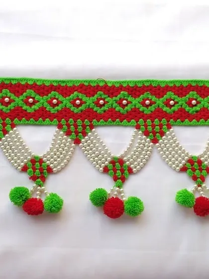 This photo shows the entire length of the 3-foot traditional beaded toran, ready to adorn a doorway.