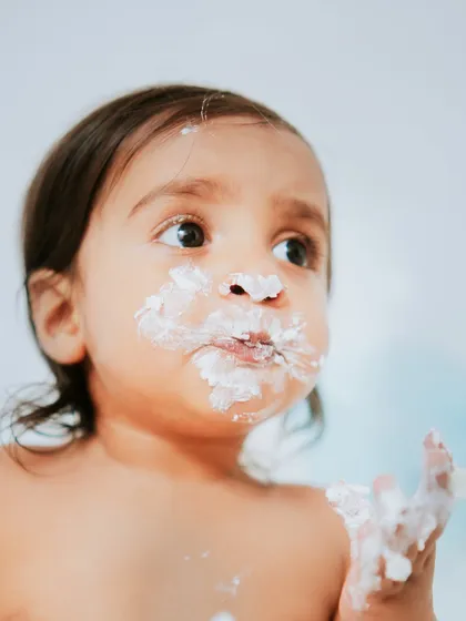 A thoughtful, puffy-cheeked moment of enjoying his cake. I love capturing these quiet, in-between expressions.