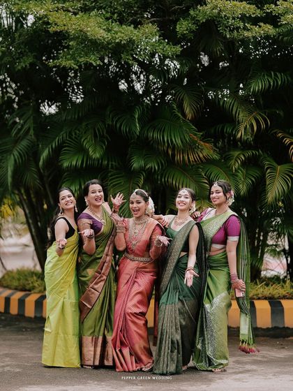 A fun and candid moment with the bride and her bridesmaids sharing a laugh together.