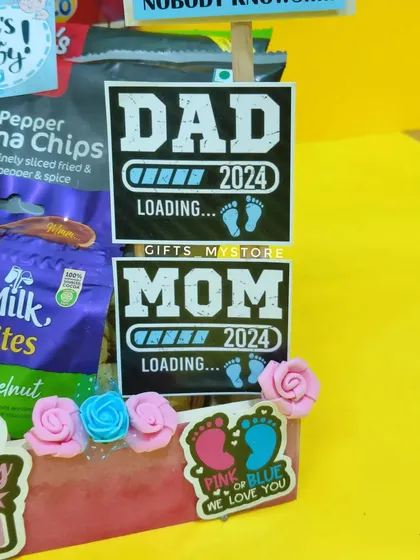 "Dad loading... Mom loading..." Fun tags for the parents-to-be, included in the baby shower hamper.