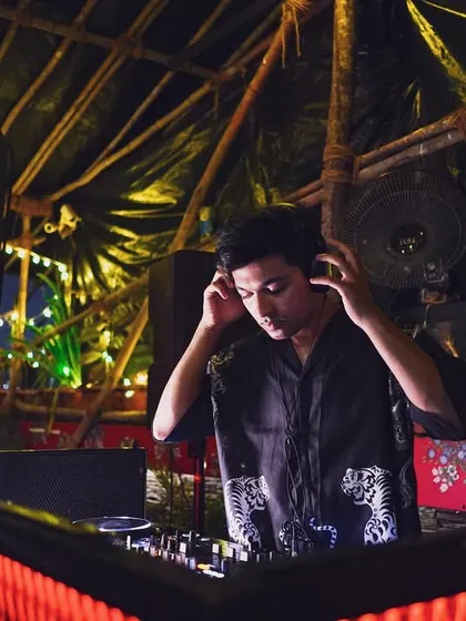 Adjusting the headphones, getting ready for the next track. A candid moment of focus at Raasta Bombay.