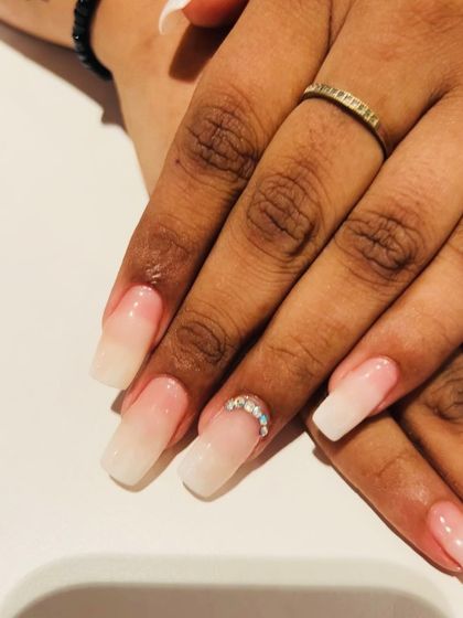 A close-up on the crescent moon rhinestone placement on these beautiful ombre French nails. It's all in the details.