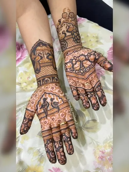 A design featuring Radha and Krishna, with peacocks on the wrist. The intricate patterns and figures make it perfect for any festive occasion.
