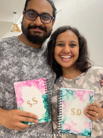 Celebrating a special milestone? This wonderful couple marked their anniversary with a private alcohol ink workshop, crafting personalized diaries together. It's a unique and creative way to celebrate your love.